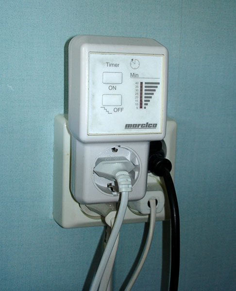 Timer, a small bos on wall plug