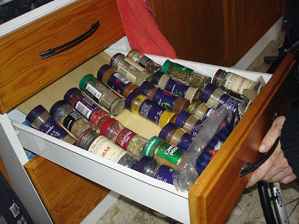 Open kitchen drawer with spice rack