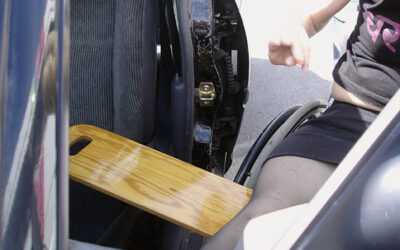 Broom handle for back support when transferring to automobile
