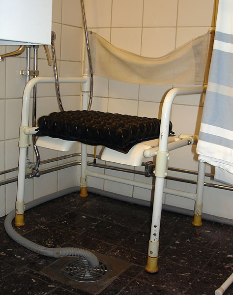 Small chair for shower with armrest and back