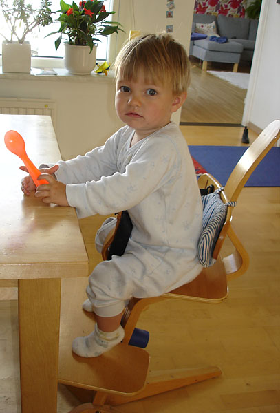 Child sitting in children's chair