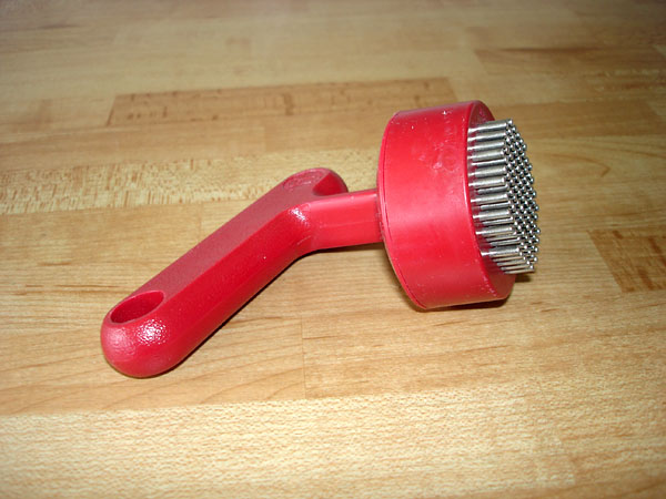 Universal knob: on a grip-friendly handle is a surface with many small moving metal spikes.
