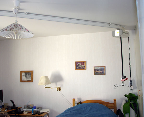 Bedroom with ceiling track and ceiling lift