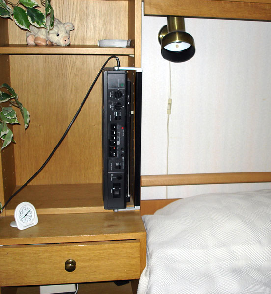 Radio standing on edge on night table