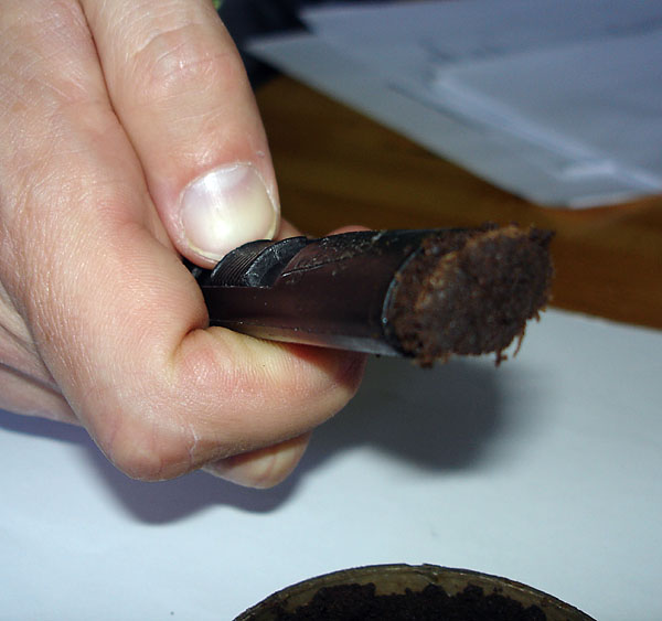 A portion of snus comes out from the 'Prismaster'.