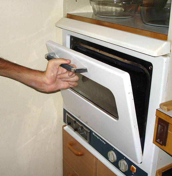 User opens oven door