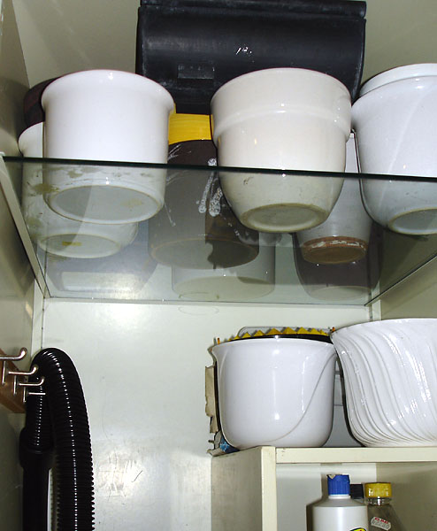 Glass shelves in cleaning cabinet