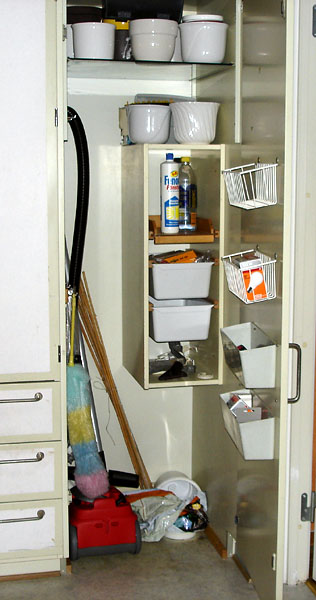 Cleaning cabinet with open door