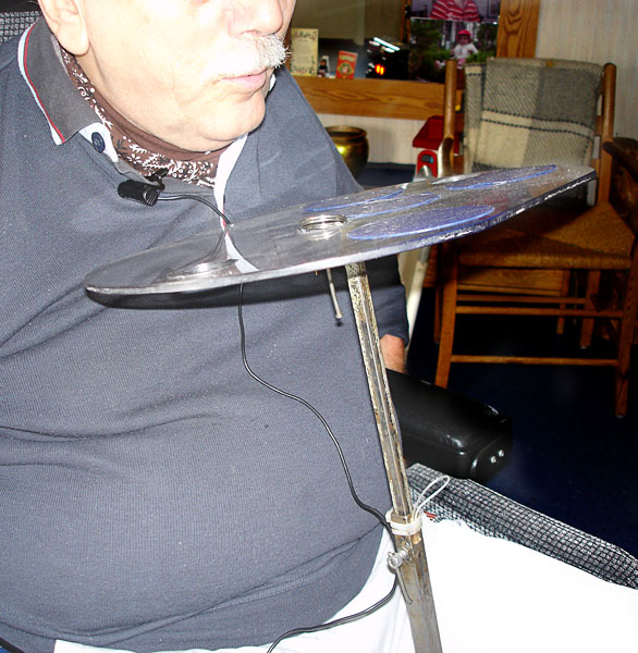The user with wheelchair table on stand in high position