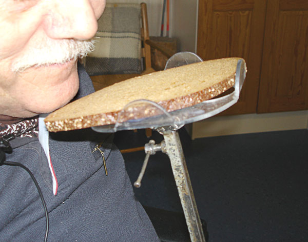 Sandwich on wheelchair table at mouth height