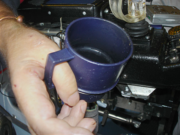 User picks mug up from holder