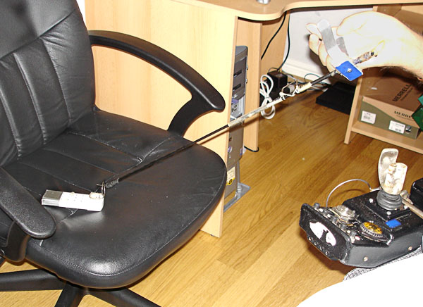 User places remote control unit on chair