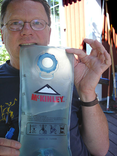User with fluid bag (close-up)