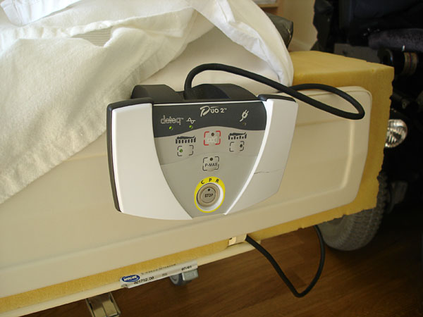 Control unit sitting on the footboard of the bed