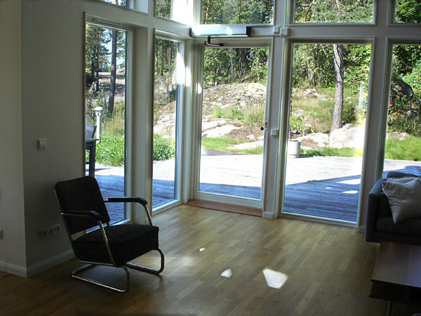 Living room with large window and access to terrace