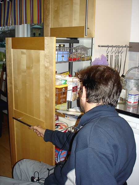 User opens pantry with slide-out storage