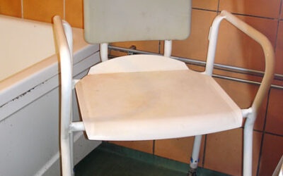 Shower chair with back and armrest