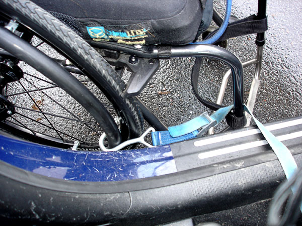 Securing the wheelchair during transfers to and from the car