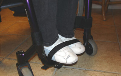 Securing feet to wheelchair foot bar