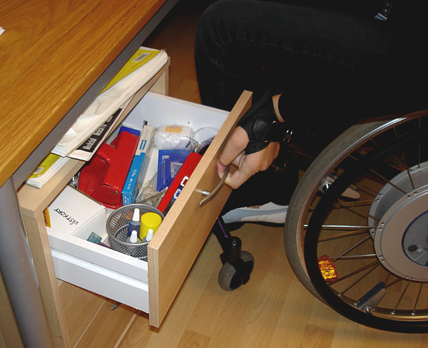 User opens drawer (close-up of hand)