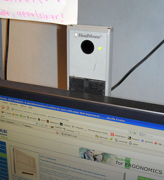 Receiver of the head mouse. a small white box, sits above the computer screen.