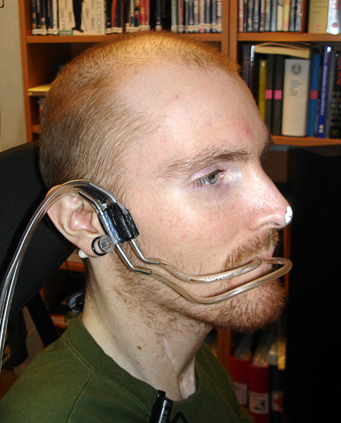 Headset from the side with 2 sip/puff controls