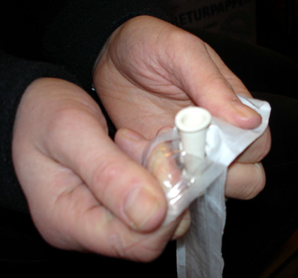 User opens the upper portion of the catheter bag