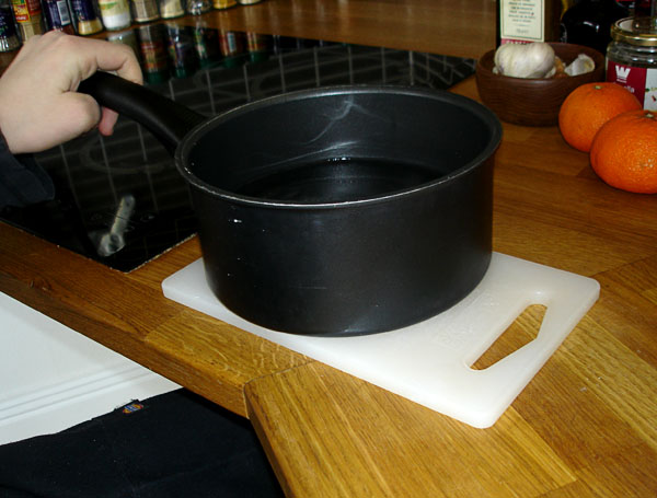 Pot on cutting board