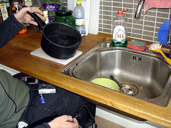 User drains water in sink