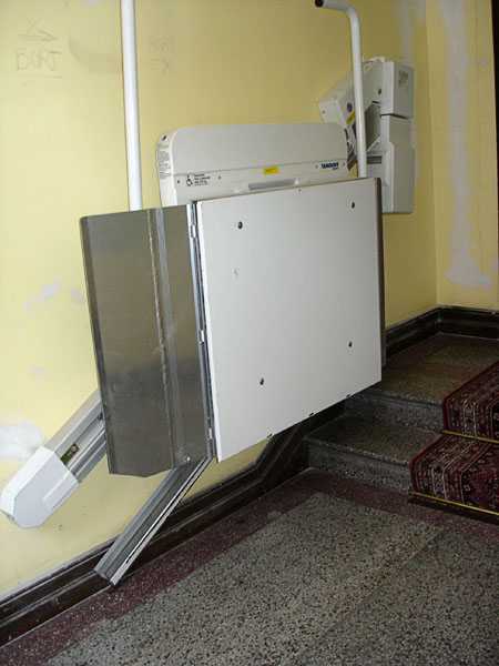 Platform elevator, folded against wall