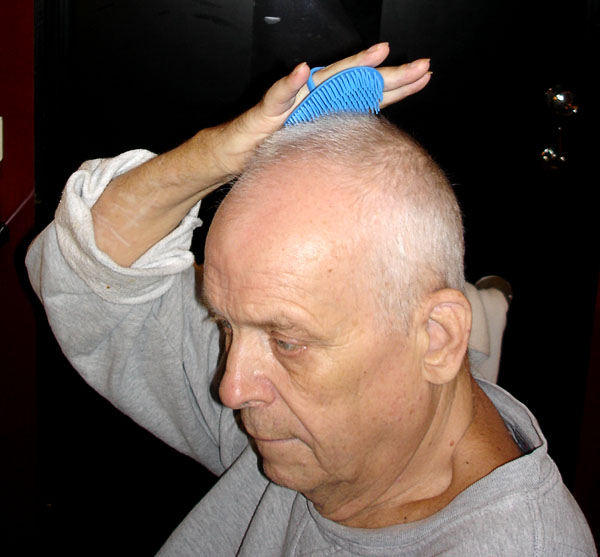 User with hair brush – viewed from the front