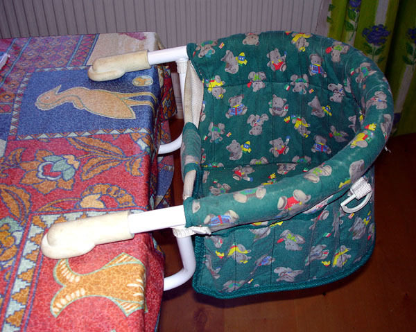 Child's seat attached to table