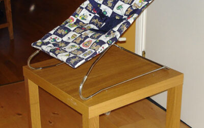 Babysitter chair on table