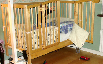 Crib, adjustable height power-operated