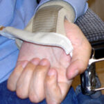 Universal holder on wrist bandage
