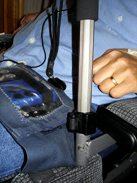 Binocular tripod on wheelchair attachment fitting (close-up)