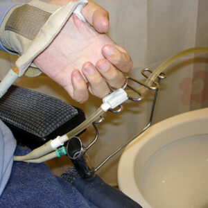 Emptying the urinary bladder using a holder for the urin tube