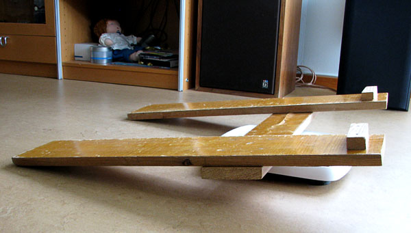 H-shaped wooden stand, viewed from the side.