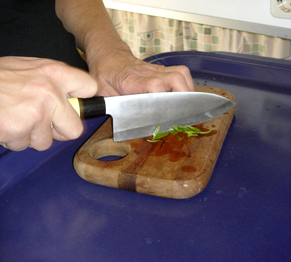 User cuts vegetables