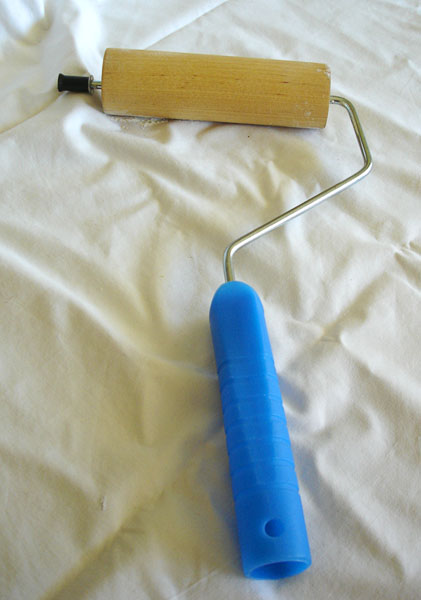 Rolling pin made from a toy rolling pin and a paint roller clamp (close-up)