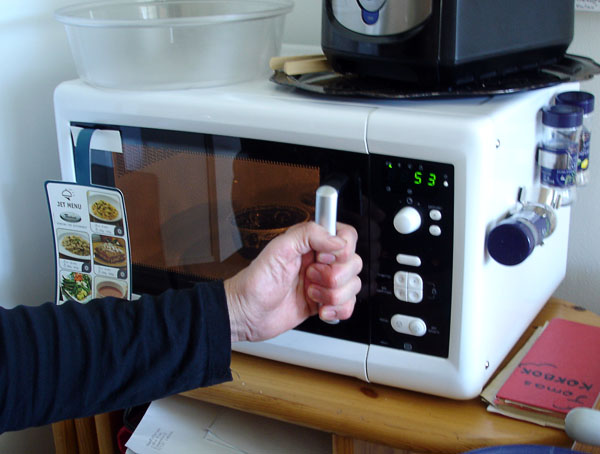 User opens microwave oven