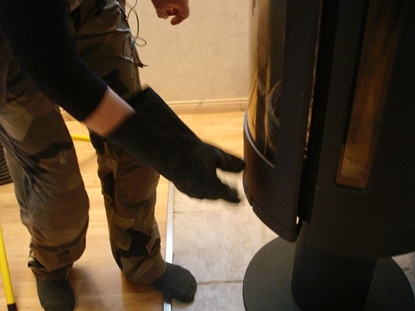 User closes door of wood stove