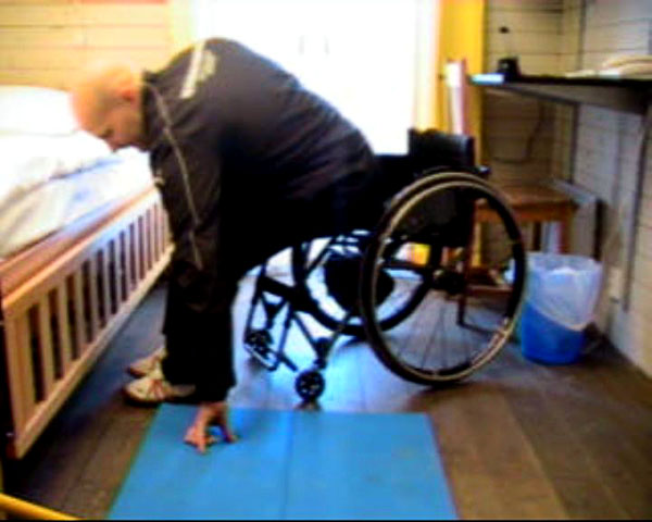 User transfers from wheelchair to floor