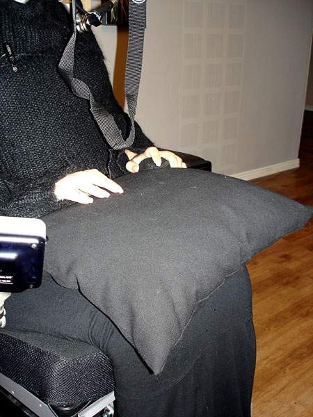 User with lap cushion