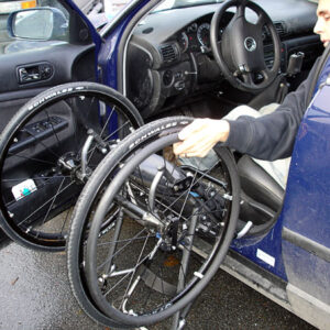 Lifting the wheelchair into the car