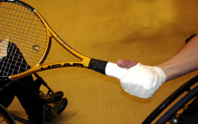 Taping tennis racket in place