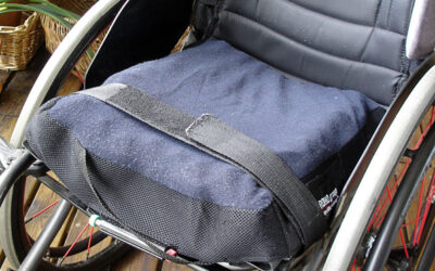 Wheelchair – strap that holds wheelchair cushion in place