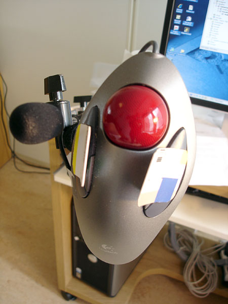 Microphone for VoiceXpress on the same holder as trackball mouse.
