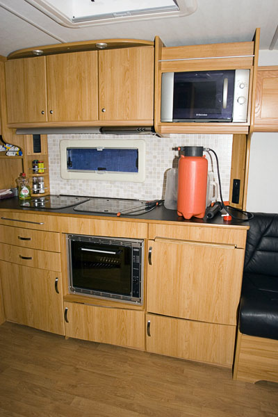 Caravan interior, built-in kitchen.   