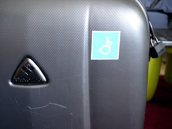 Suitcase with wheelchair symbol